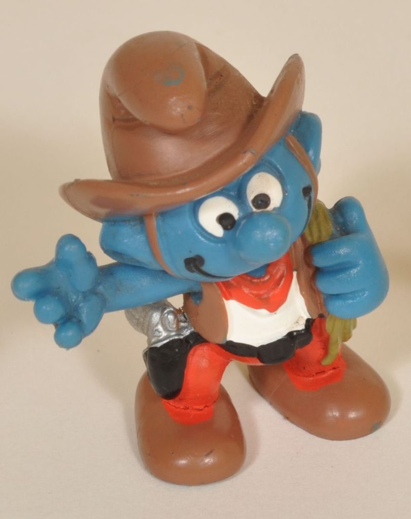 Photograph of Smurf figurine in cowboy outfit